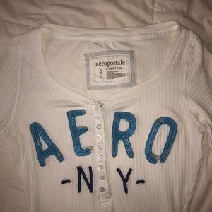 Form fitting white long sleeve ribbed top